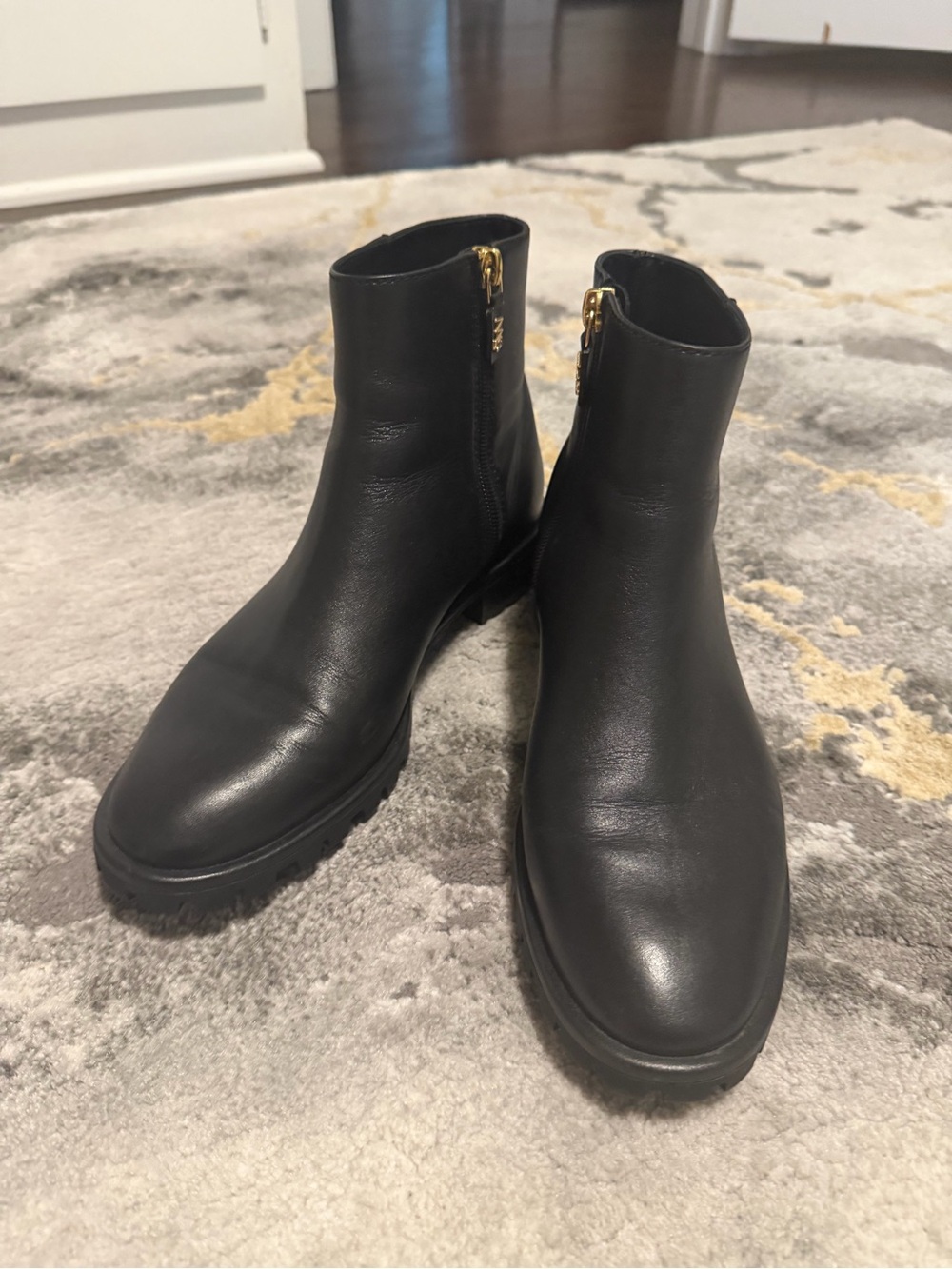 Stuart Weitzman Black Leather Ankle Booties with Gold Zipper
